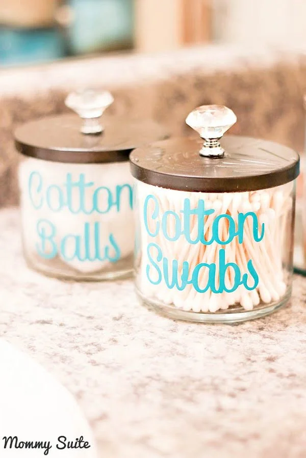 Repurpose candle jars into shabby bathroom accessory holders. Neat idea!