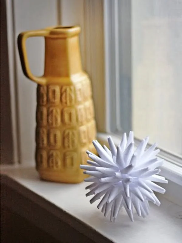 Neat idea! paper porcupine ball for home decor.