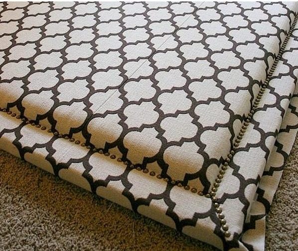 Check out this tutorial on how to make a upholstered with nail trim headboard. Looks easy enough!