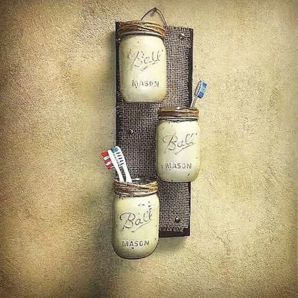 mason jar wall shelves for rustic bathroom decor