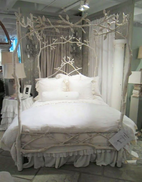 Love the shabby chic style of this decorative tree branch bed frame 
