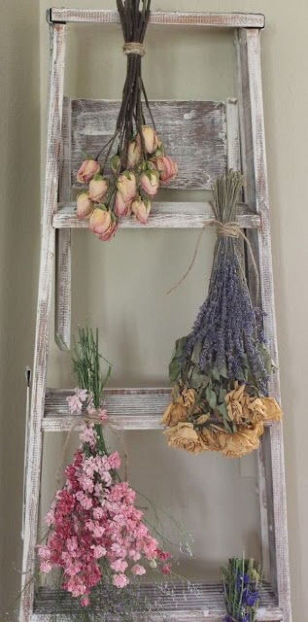 Lovely idea of a shabby chic ladder and floral decor for bedroom