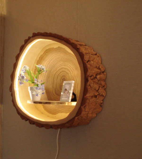 Check out this adorable tree trunk lamp shelf 