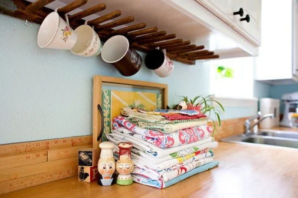 13 Brilliant DIY Mug Racks You'll Have Fun Making - Love the idea for a DIY coffee mug rack under the cabinet