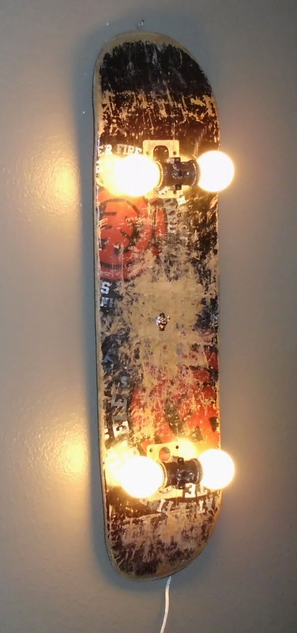 Check out this cool wall lamp made of an old skateboard 