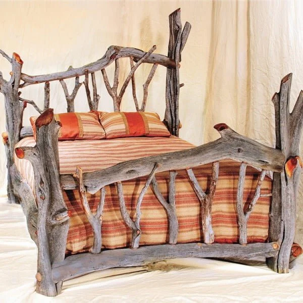 Love the bed frame made of driftwood and its rustic appeal 