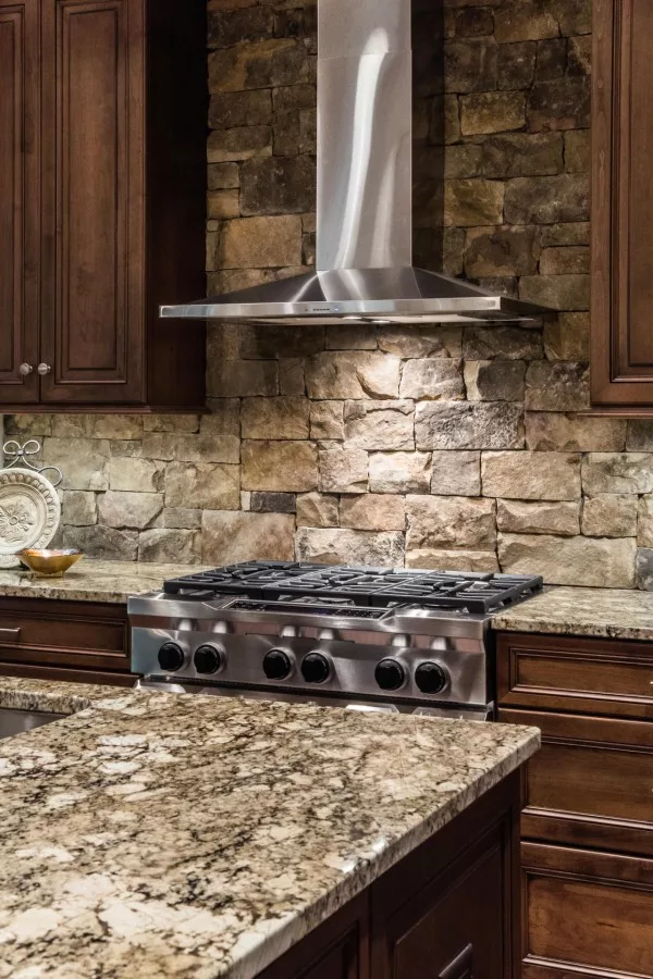  countertops and exposed stone walls work just so well in this  decor! 