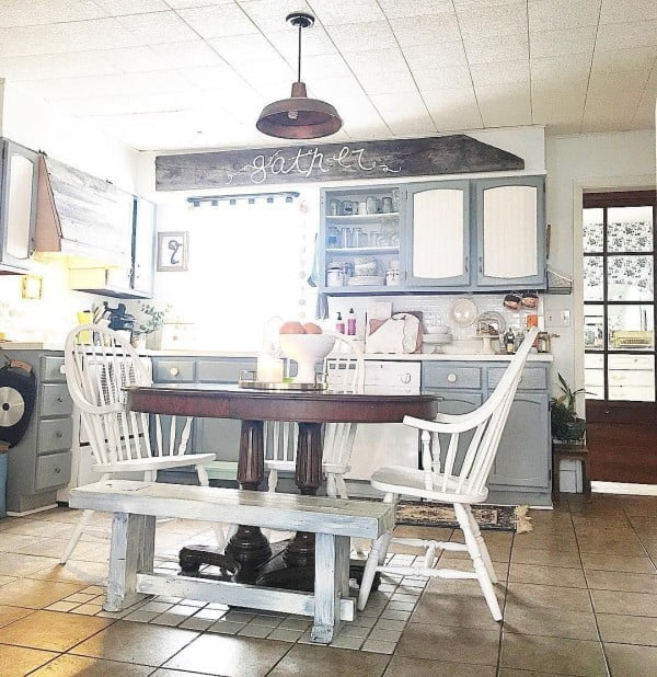 Mismatched table and chairs make a great decor statement here. Love this  kitchen!  