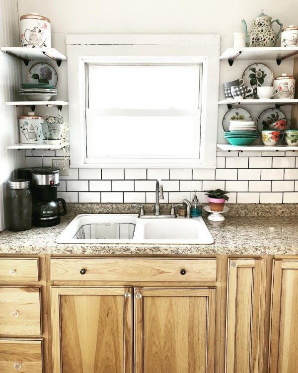 Subway tiles, wood cabinets, granite countertops and  shelves. I'm in love!  