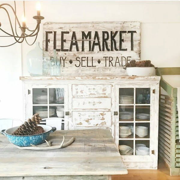 Vintage signs can make or break  decor. In this case it works perfectly. Love it!  