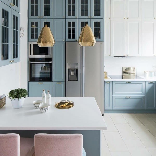 You have to see these soft blue kitchen cabinets with metallic accents and pops of rose gold. Love it!