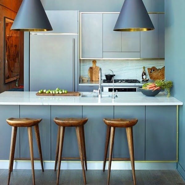 You have to see these blue kitchen cabinets with rustic and metallic accents. Love it!