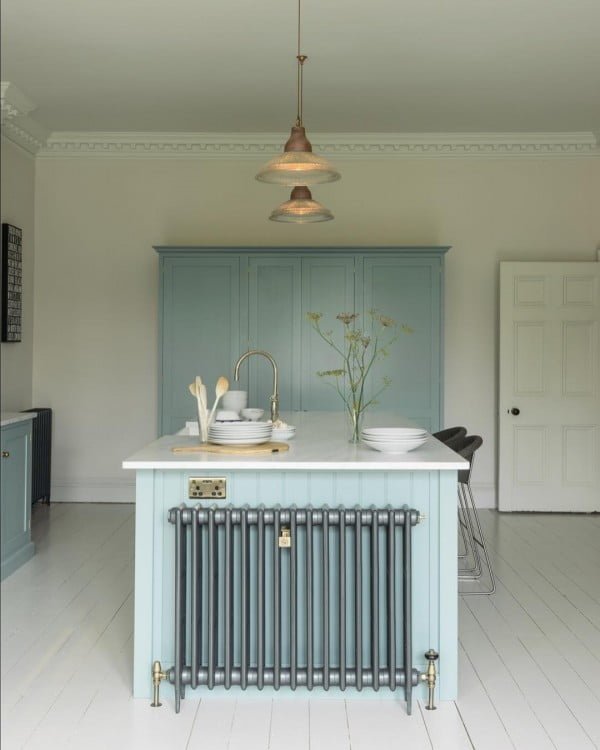 You have to see these soft blue kitchen cabinets with white walls. Love it!