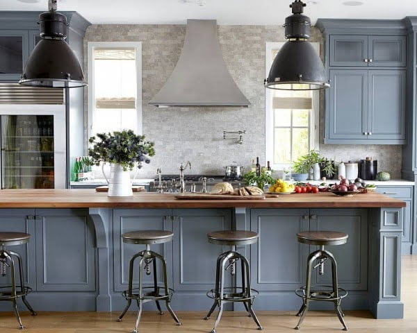 You have to see these blue kitchen cabinets with metallic accents. Love it!