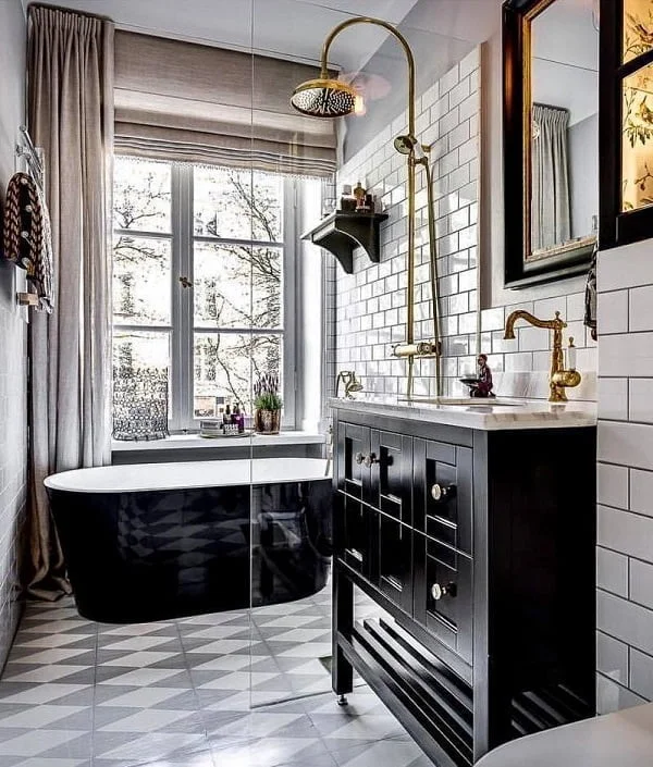 Going for the classy look with subway tile and black cabinets with metallic accents. Love this!    