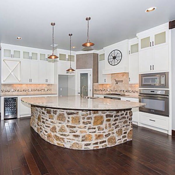 Check out this unusual kitchen design with a masonry island counter. Love it!