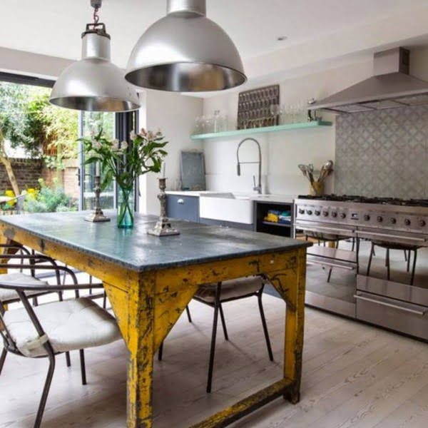 Check out this unusual kitchen design with stainless steel and rustic elements. Love it!    