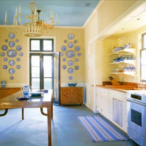 Check out this unusual kitchen design in a bright yellow and pale blue palette. Love it!