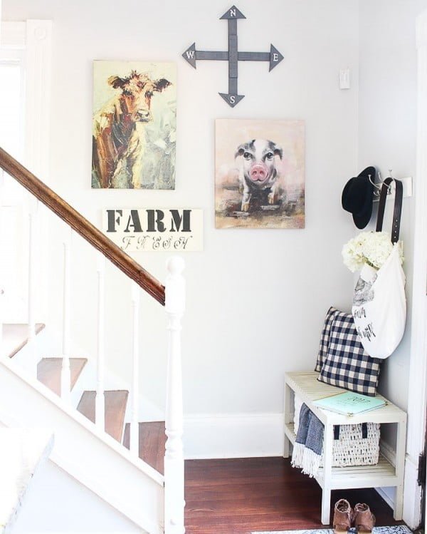 Check out this entryway decor idea with farmhouse signs. Love it!