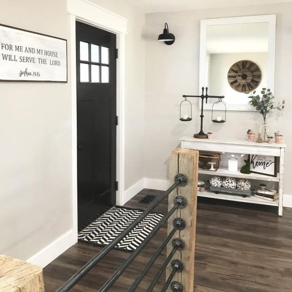 Check out this entryway decor idea with a mirror and an oversize clock. Love it!