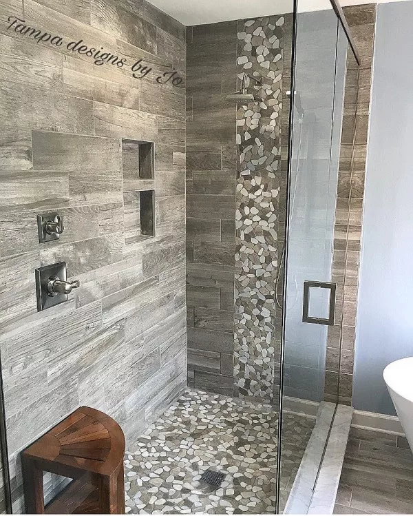 You have to see this bathroom decor idea with wood tile and pebble mosaic that will turn your bathroom into SPA!  