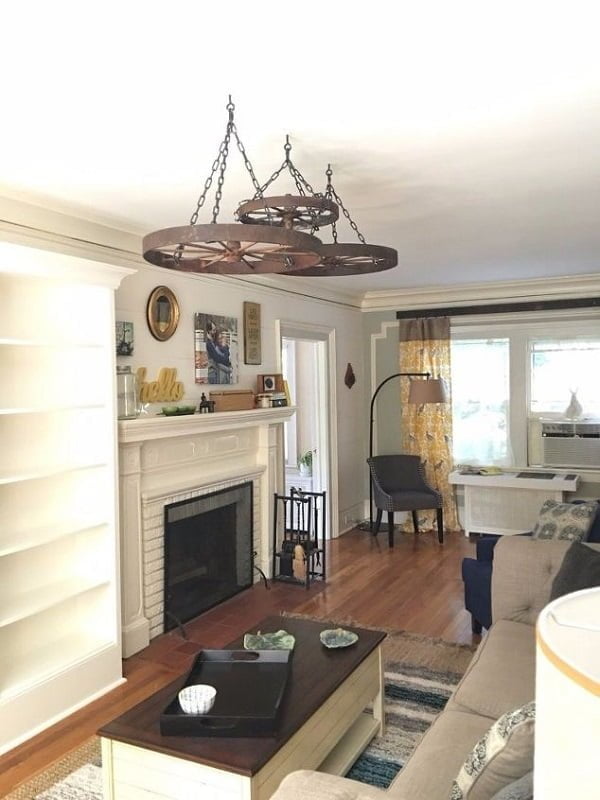  living room decor idea with a wagon wheel chandelier. Love it!  
