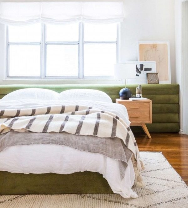 Check out this tutorial on how to make a channel tufted headboard. Looks easy enough!