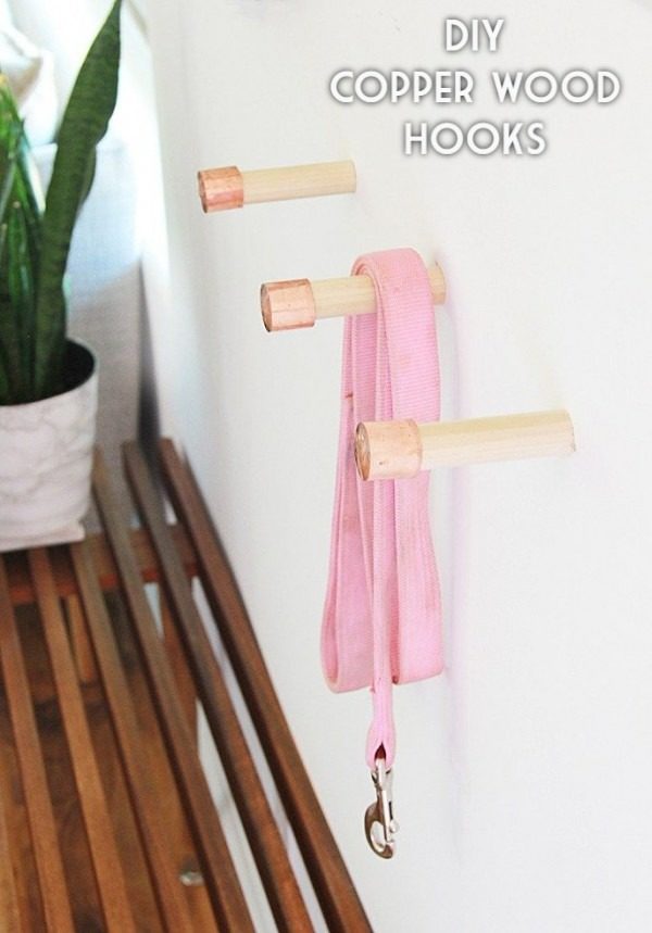 Check out the tutorial on how to make  copper wood hooks. Looks easy enough!  