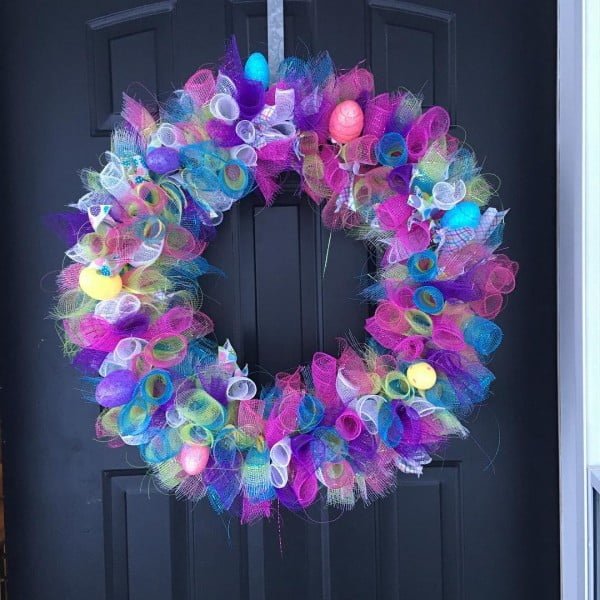 Check out this   wreath idea with festive ribbons. Love it! 