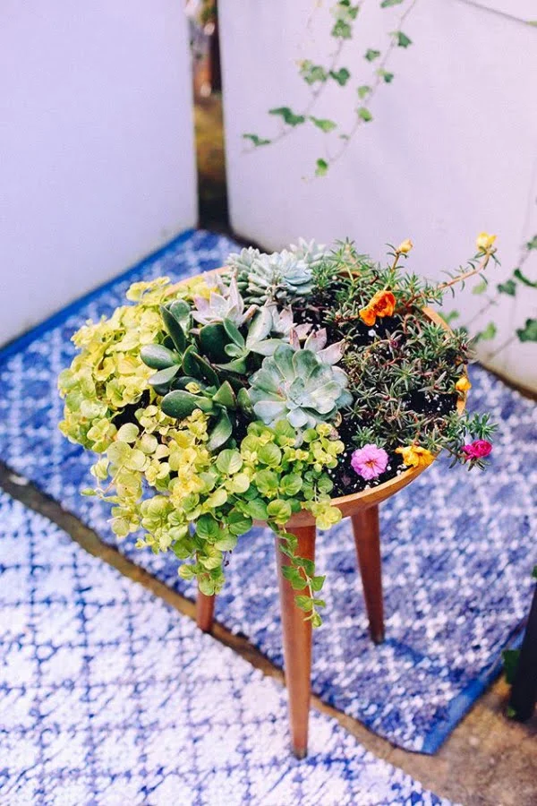 Great idea! Check out the tutorial on how to make a  tripod garden planter 