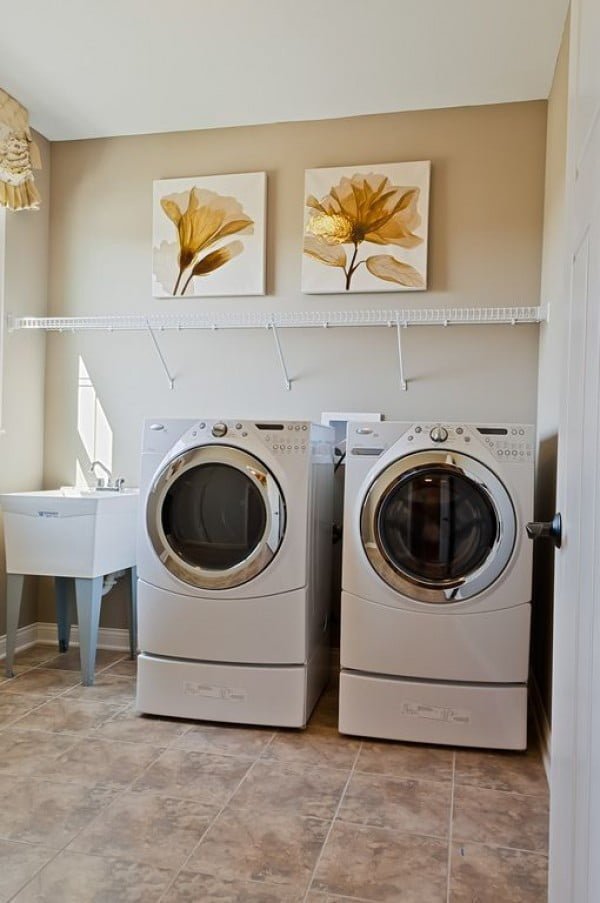 100 Fabulous Laundry Room Decor Ideas You Can Copy - You have to see this laundry room decor idea with wall art. Love it!