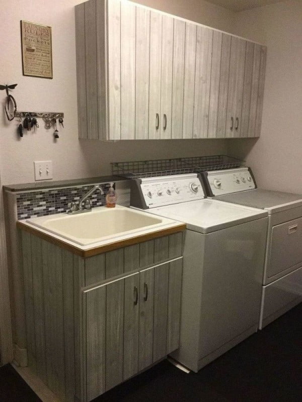 100 Fabulous Laundry Room Decor Ideas You Can Copy - You have to see this laundry room decor idea with cabinet wallpaper. Love it!  