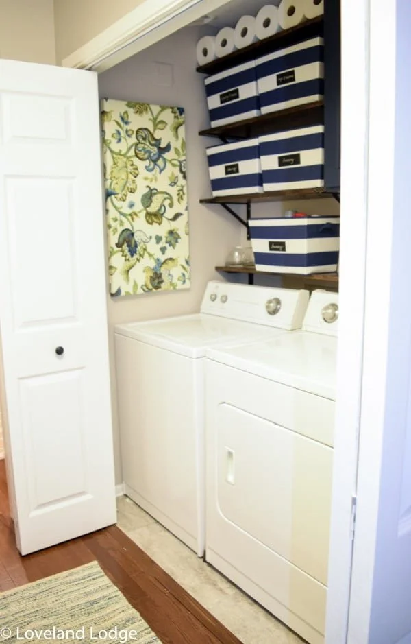 100 Fabulous Laundry Room Decor Ideas You Can Copy - You have to see this laundry room decor idea with floral wall art. Love it!