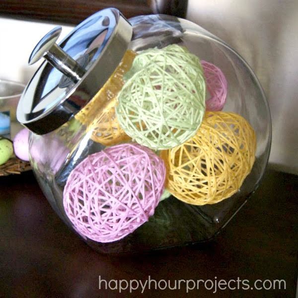 Check out this cute #Easter decor idea with yarn eggs. Love it! #HomeDecorIdeas