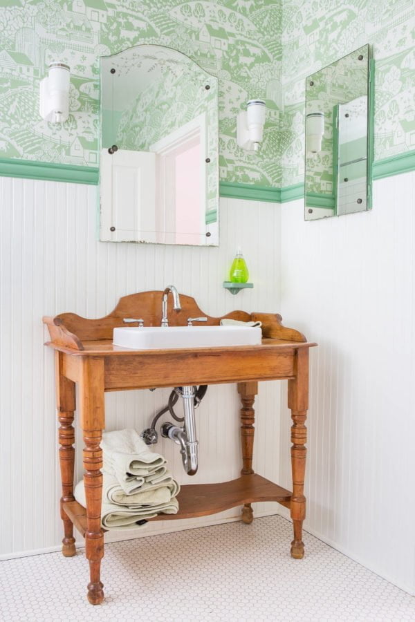 100 Cozy Rustic Farmhouse Bathroom Decor Ideas You Can Easily Copy - You have to see this bathroom decor idea with mosaic white tile flooring and vintage wash sink. Love it!  