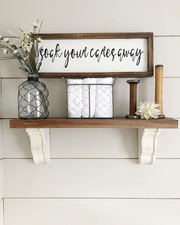 100 Cozy Rustic Farmhouse Bathroom Decor Ideas You Can Easily Copy - You have to see this bathroom decor idea with framed retro quote and ideal towel container. Love it!  