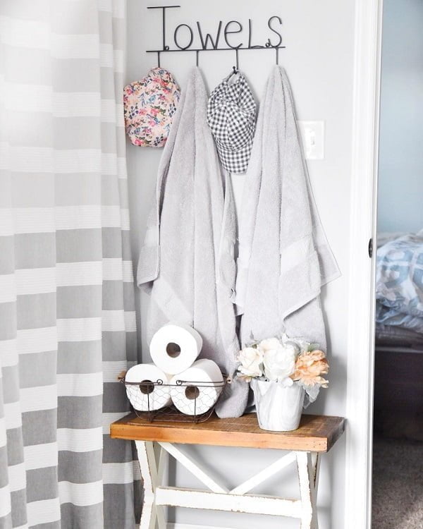 100 Cozy Rustic Farmhouse Bathroom Decor Ideas You Can Easily Copy - You have to see this bathroom decor idea with bedroom entrance and intriguing toilet paper holder. Love it!  