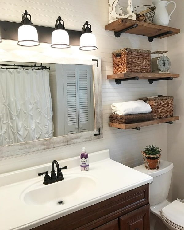 100 Cozy Rustic Farmhouse Bathroom Decor Ideas You Can Easily Copy - You have to see this bathroom decor idea with multiple wooden shelves and attainable openess. Love it!  