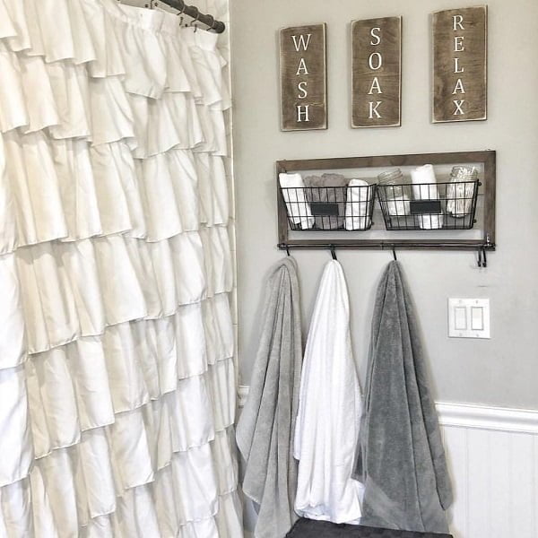 100 Cozy Rustic Farmhouse Bathroom Decor Ideas You Can Easily Copy - You have to see this bathroom decor idea with metal countryside towel holder, and half-size wooden wall. Love it!  