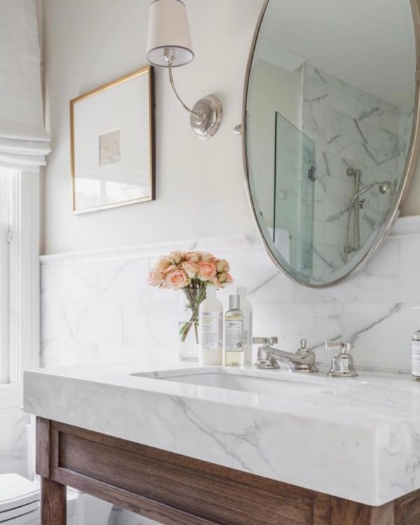 100 Cozy Rustic Farmhouse Bathroom Decor Ideas You Can Easily Copy - You have to see this bathroom decor idea with discrete lighting and hanlfway white marble wall. Love it!  