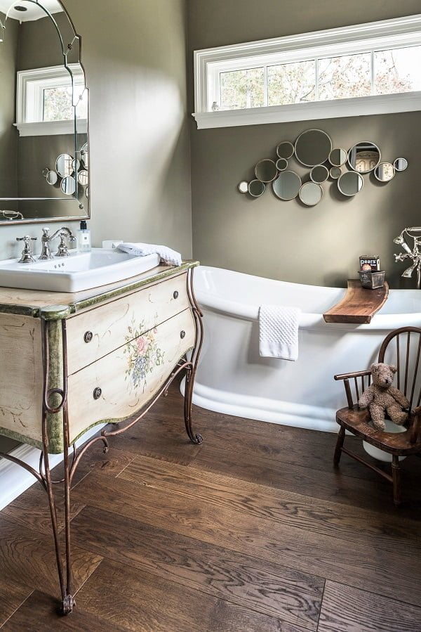 100 Cozy Rustic Farmhouse Bathroom Decor Ideas You Can Easily Copy - You have to see this bathroom decor idea with drop-in sink and vintage night stand cabinet. Love it!  