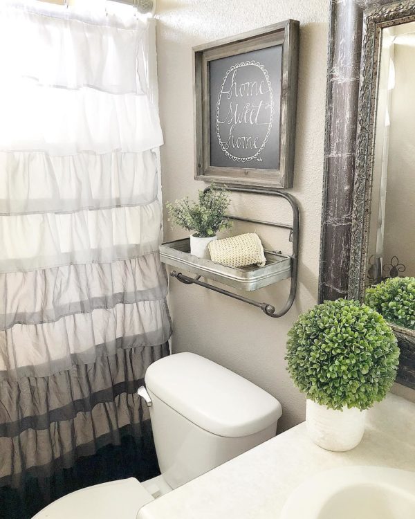 100 Cozy Rustic Farmhouse Bathroom Decor Ideas You Can Easily Copy - You have to see this bathroom decor idea with framed rustic mirror and classic porcelain sink. Love it!  