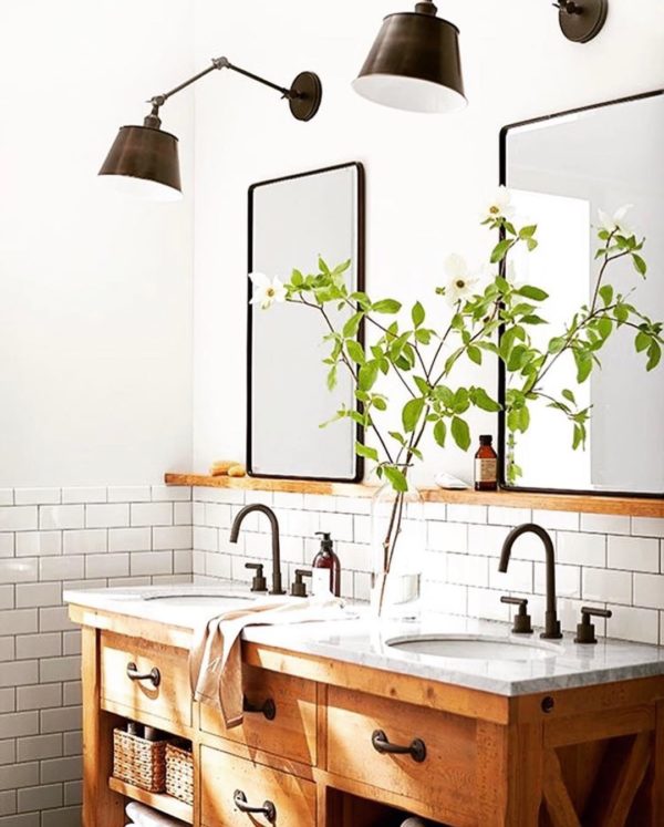 100 Cozy Rustic Farmhouse Bathroom Decor Ideas You Can Easily Copy - You have to see this bathroom decor idea with wooden udner-mirror shelves and brick tile halfway wall. Love it!  