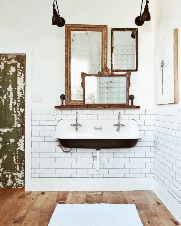 100 Cozy Rustic Farmhouse Bathroom Decor Ideas You Can Easily Copy - You have to see this bathroom decor idea with hardwood flooring, white brick tile wall and rustic entrance door. Love it!  