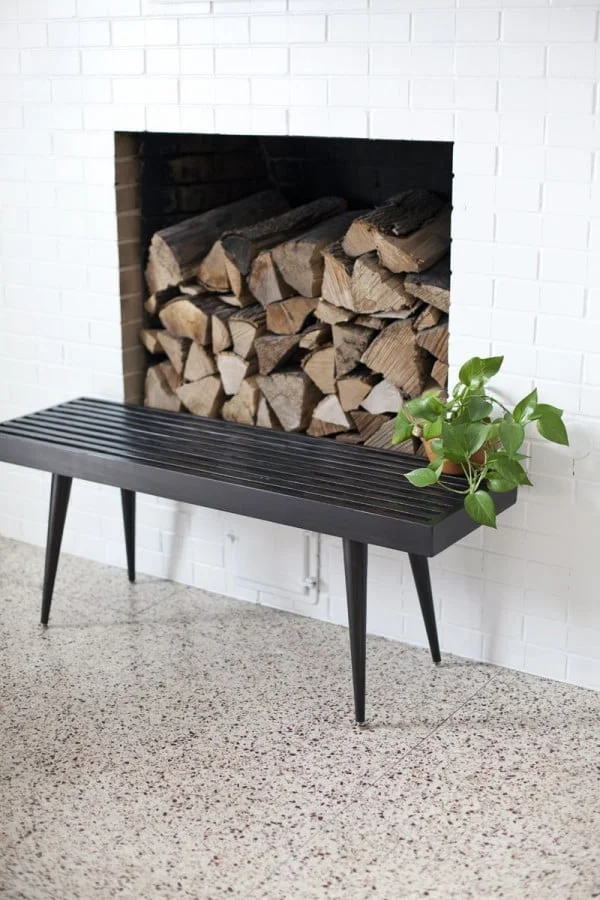 Check out the tutorial on how to make a DIY slatwood bench. Looks easy enough! 