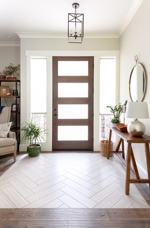  decor idea with dark iron chandelier and hardwood-glass entrance door. Love it!   