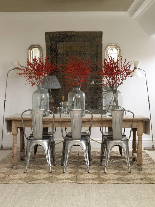  decor idea with oriental hanging wall carpet and old-school wooden table. Love it!   