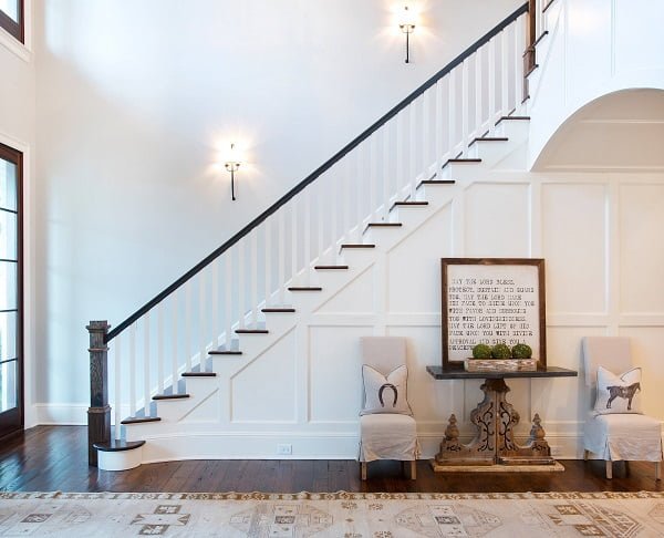  decor idea with dark hardwood floor and startling innovative foyer table. Love it!   