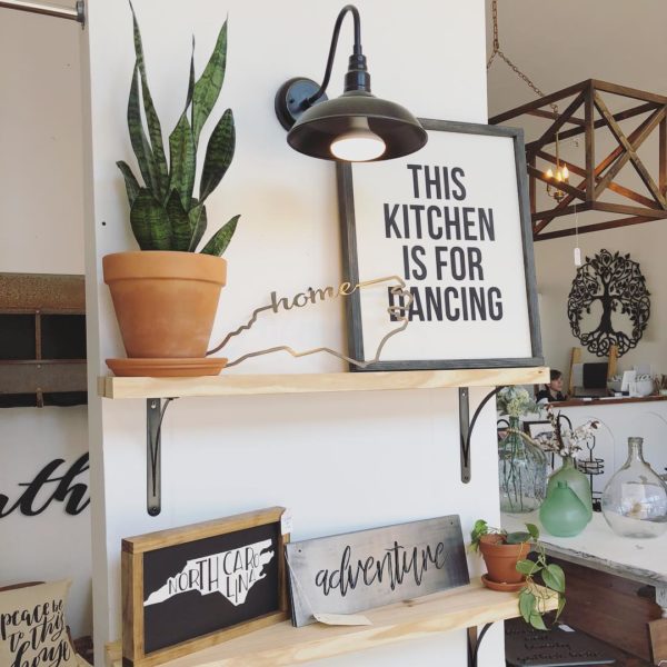  decor idea with a rustic background chandelier and traditional flower pots. Love it!   