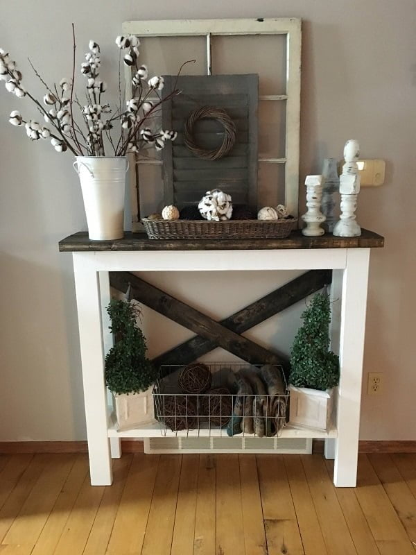  decor idea with metal storage basket, a tin vase and contrasting mix of floral decor. Love it!   